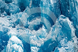 Closeup shot of the ice texture of a blue glacial wall in Inside Passage, Alaska