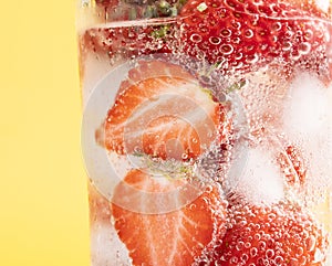 Closeup shot of iced strawberries in a glass