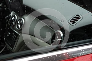 Closeup shot of the interior of Mercedes GLA 200 on a rainy day photo
