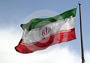 Closeup shot of an Iranian flag waving in the wind