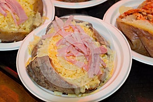 Closeup shot of jacked potatoes in a plastic plate in London, England