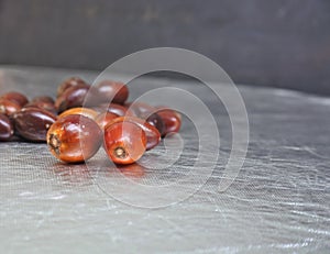 Closeup shot of jujubes bunch on a smooth metal surface