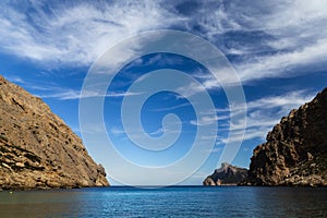 Closeup shot of a lake surrounded by cliffs in Mallorca, Boquer Valley