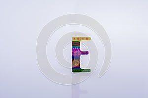 Closeup shot of the letter E figure with colorful patterns on a white background