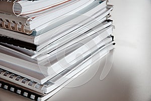 Closeup shot of a lot of copybooks lie on top of each other - Home learning concept