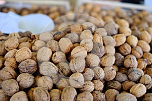 Closeup shot of a lot of walnuts in a food market