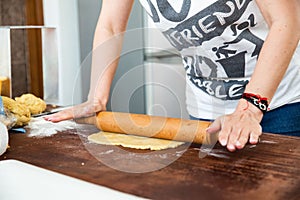 Closeup shot of a man making dough.