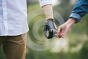 CloseUp Shot Of Man With a prosthetic limb Holding Hands With Female Partner