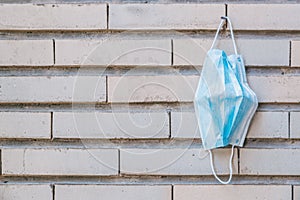 Closeup shot of medical face mask hanging on the wall