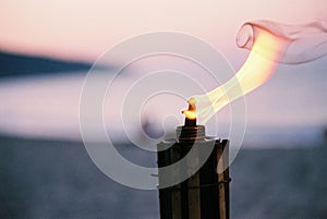 Closeup shot of a metal lighter with flame