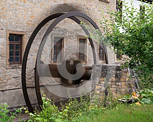 Closeup shot of mill wheel in motion, old watermill of Bad Sobernheim, Germany