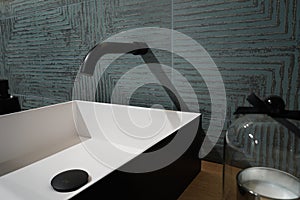 Closeup shot of a modern ceramic sink in the bathroom