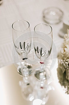 Closeup shot of Mr and Mrs champagne sparkling wine glasses