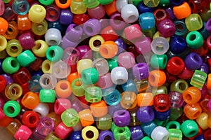 Closeup shot of multi-colored plastic beads for handicraft