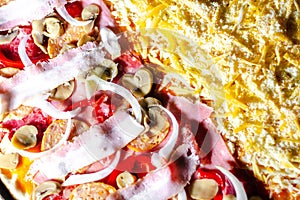 Closeup shot of a mushroom and ham pizza with mozzarella cheese