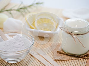 Closeup shot of natural skincare product ingredients: lemon, baking soda, and yogurt