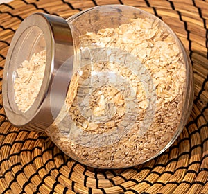 Closeup shot of oat flakes in a glass container
