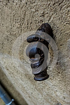 Closeup shot of an old fountain head in Burg Eltz Castle