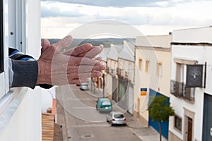 Closeup shot of an old man's hand applause to medical personnel in Spain