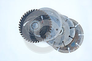 Closeup shot of old metal gears and round blades isolated on a white background