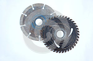 Closeup shot of old metal gears and round blades isolated on a white background