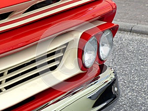 Closeup shot of an old red car headlights