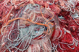 Closeup shot of old red fishing nets in Porto Cesareo, Italy