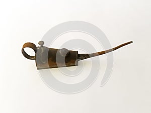 Closeup shot of an ancient rusty pump oil can with long spout isolated on a white background