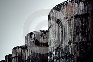 Closeup shot of old stained tanks in motive located in Elefsina Athens, Greece