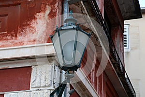 Closeup shot of an Old street lamps illuminate the way for passersby