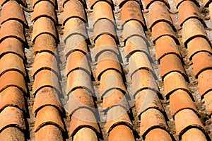 Closeup shot of an old tiles of the roof of the house