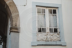 Closeup shot of an old wooden window on an ancient building in Portugal