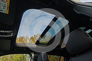 Closeup shot of open hatch detail on a roof of the modern car