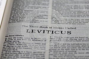 Closeup shot of open page with the third book of moses called leviticus text