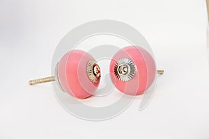 Closeup shot of a pair of knobs isolated on a white background