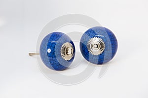 Closeup shot of a pair of knobs isolated on a white background