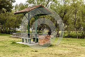 Closeup shot of a park with an open air seating area for picnics