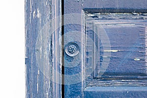 Closeup shot of part of an old blue wooden door