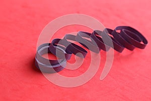 Closeup shot of a party streamer on a pink background