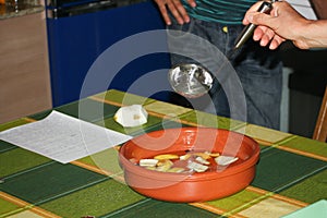 Closeup shot of people making a traditional Galician Queimada punch