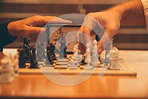 Closeup shot of people playing timed chess