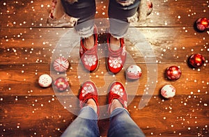 Closeup shot of a persons feet wearing red and white socks on a Christmas background, Ai-generated.