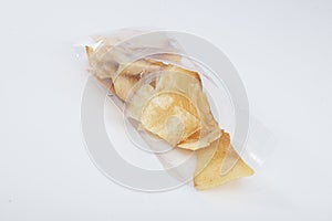 Closeup shot of a pile of crispy potato chips in a packing