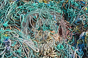 Closeup shot of a pile of old weathered green ropes