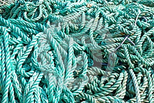 Closeup shot of a pile of old weathered green ropes