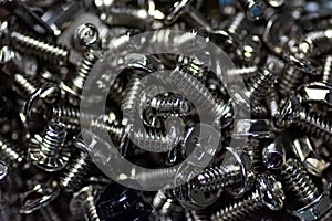 Closeup shot of a pile of silver screws and bolts