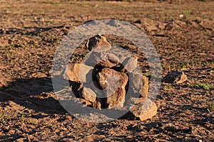 Closeup shot of a pile of small stones on the sand