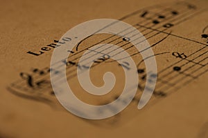 A lento tempo mark in a classical print piano score photo