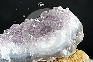 Closeup shot of pure quartz crystal cluster isolated on black background