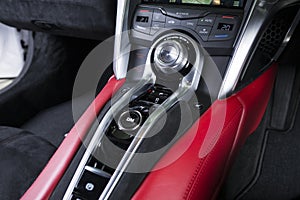 Closeup shot of red and black interior details of a modern luxury car
